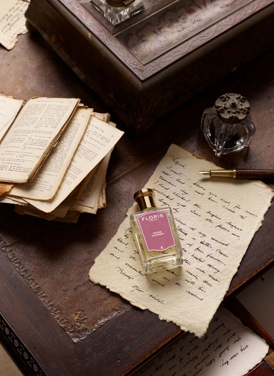 A bottle of Wilde by Floris laid on stacks of antique papers