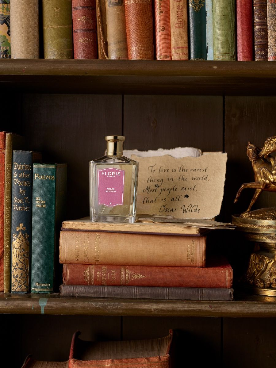 A bottle of Wilde by Floris stood on a book case filled with old books